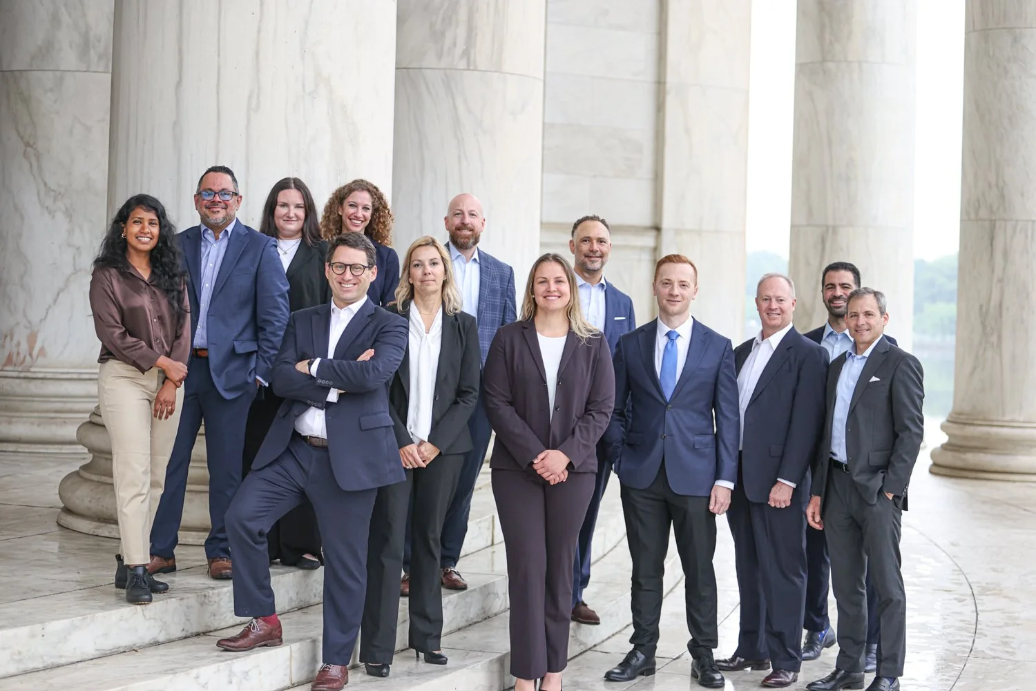 Executive team gathered outside a historic Washington, DC office building during a corporate branding photography session for Rocade Capital.