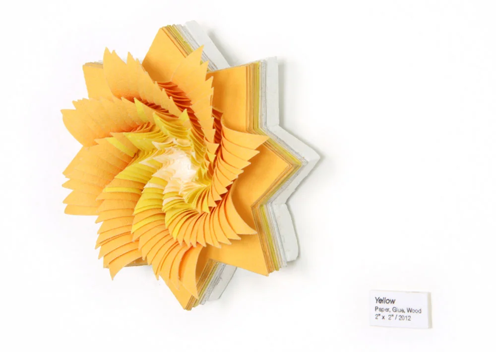  Micros (Yellow), 2012, hand-cut acid-free paper, glue, wood, 2 x 2 x 1 in each 
