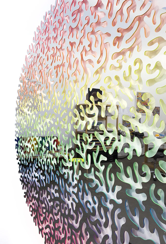  Circular Reflection (detail) , 2017, mirrored stainless steel and spray paint, 57 x 47 x 1 in 