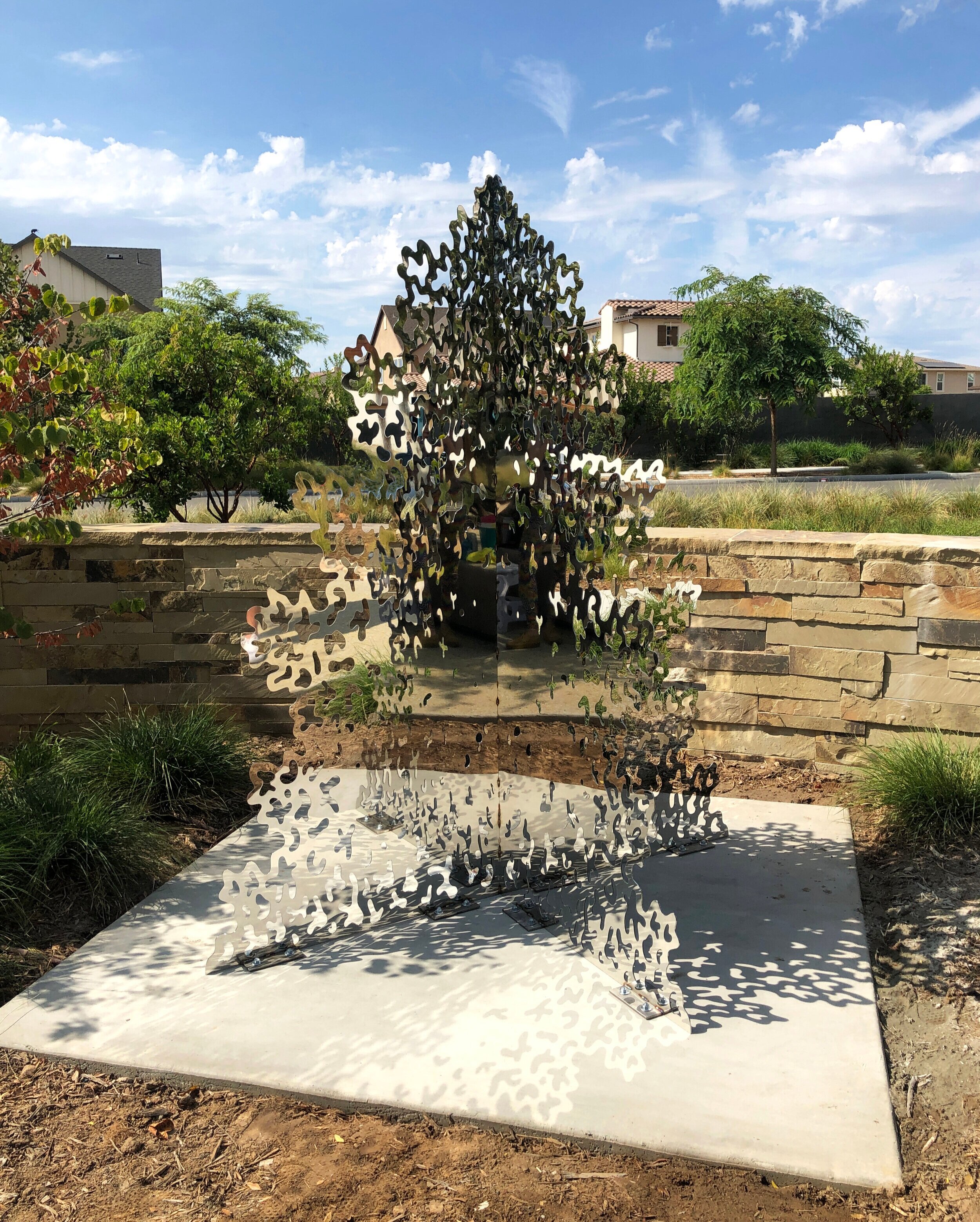 Fractal Reflections, 2019, mirrored stainless steel and ground anchors, 84 x 72 x 72 in.