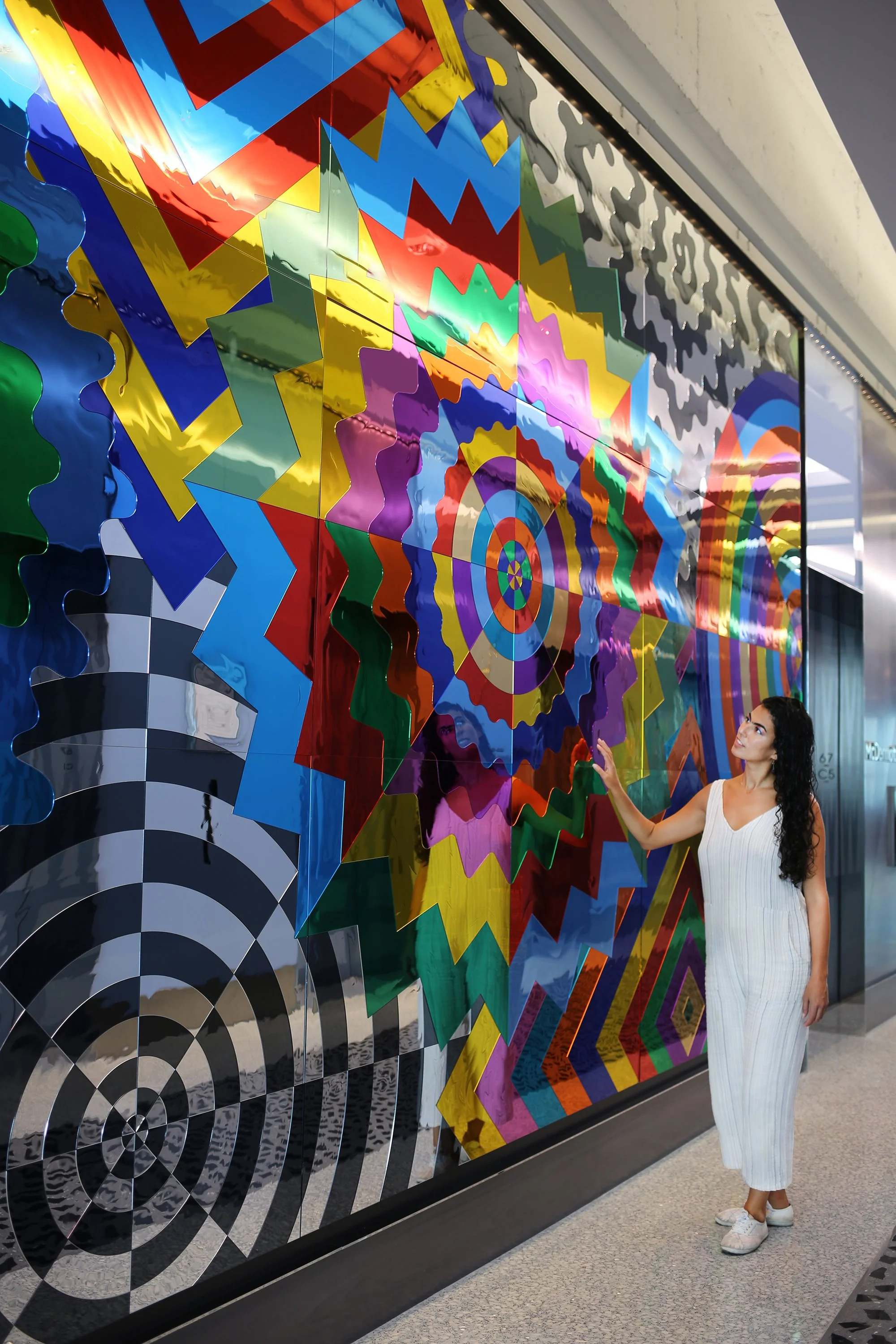   Geometric Spectrum  (installation in New York City), 2021, mirrored acrylic, adhesive, MDF, 10.66 x 41.25 ft 