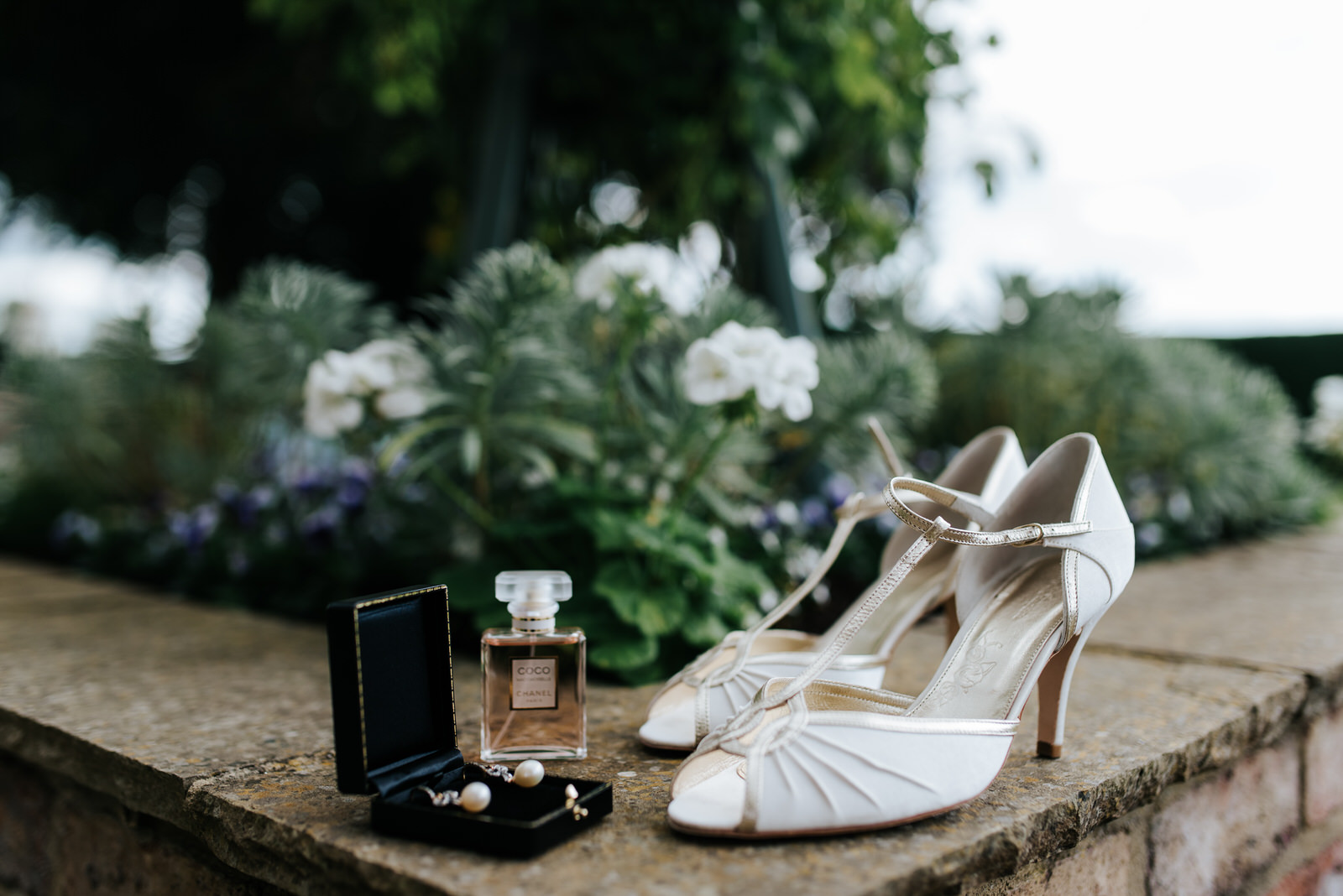 Wedding shoes and details in garden