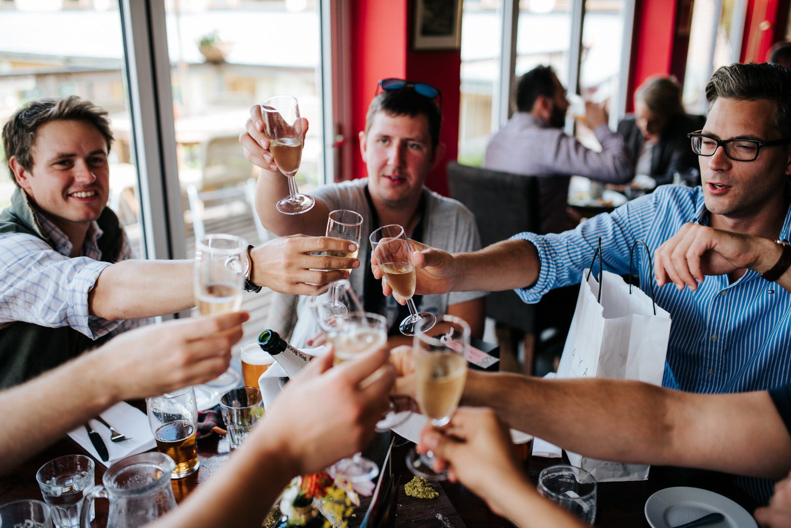 Groom and groomsmen toast at pub in Thirsk, Yorkshire