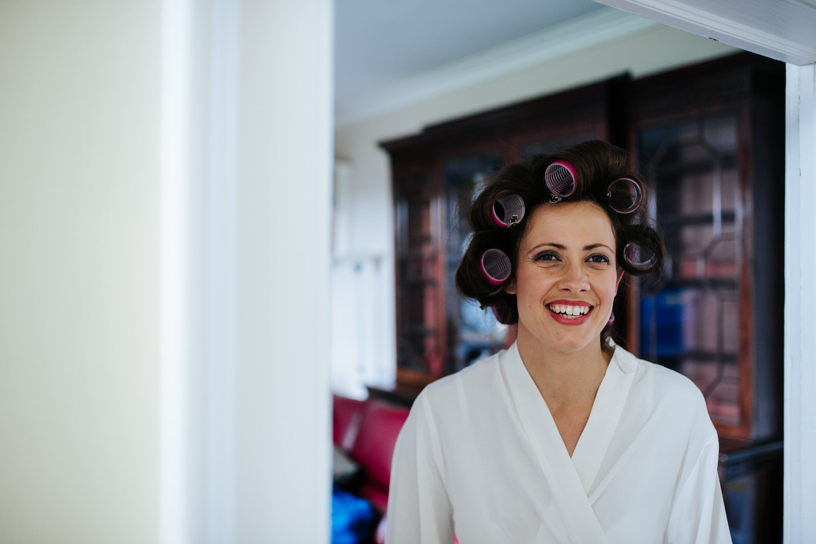 Bride looks fabulous as she gets her hair ready
