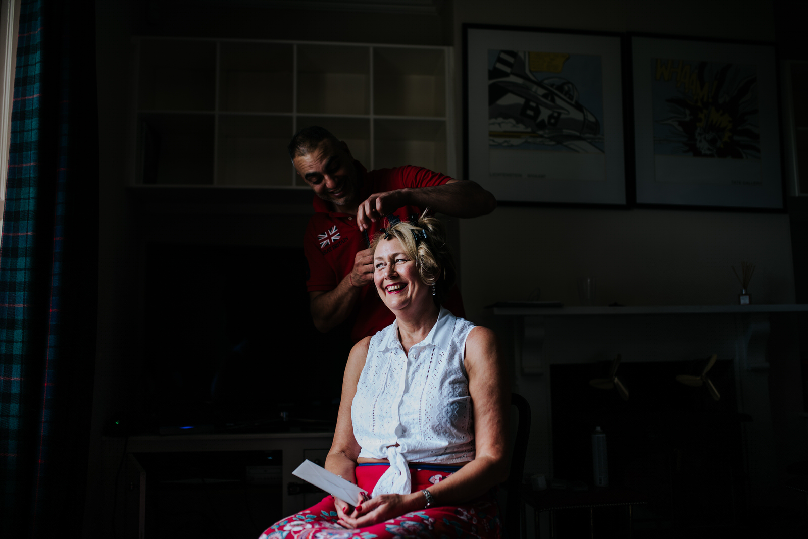 Bride's mother overjoyed while getting hair done before ceremony