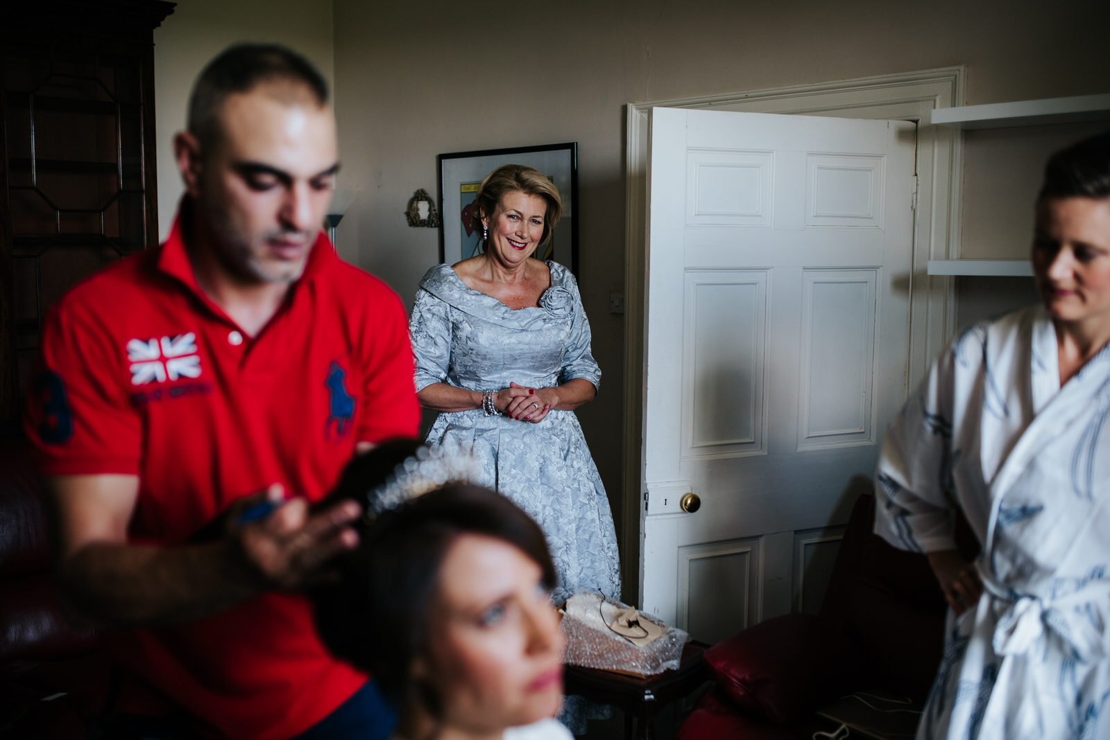 Mother of the bride looks at bride in awe