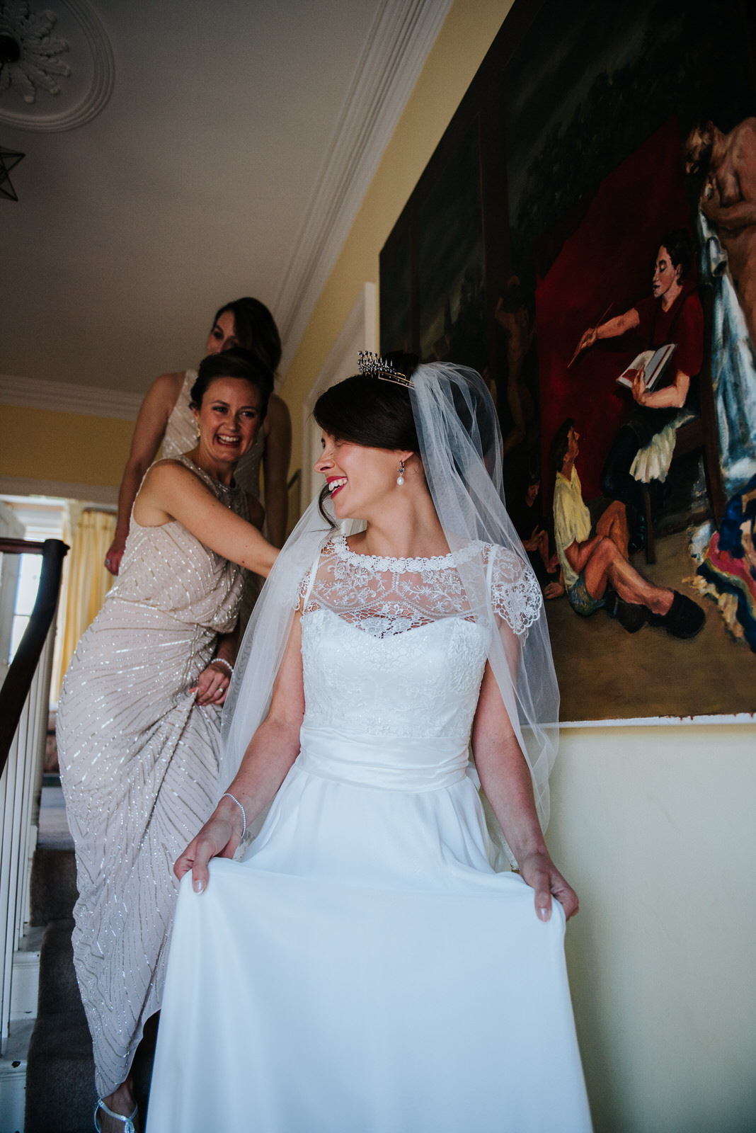 Bride looks in the mirror for the first time since putting dress