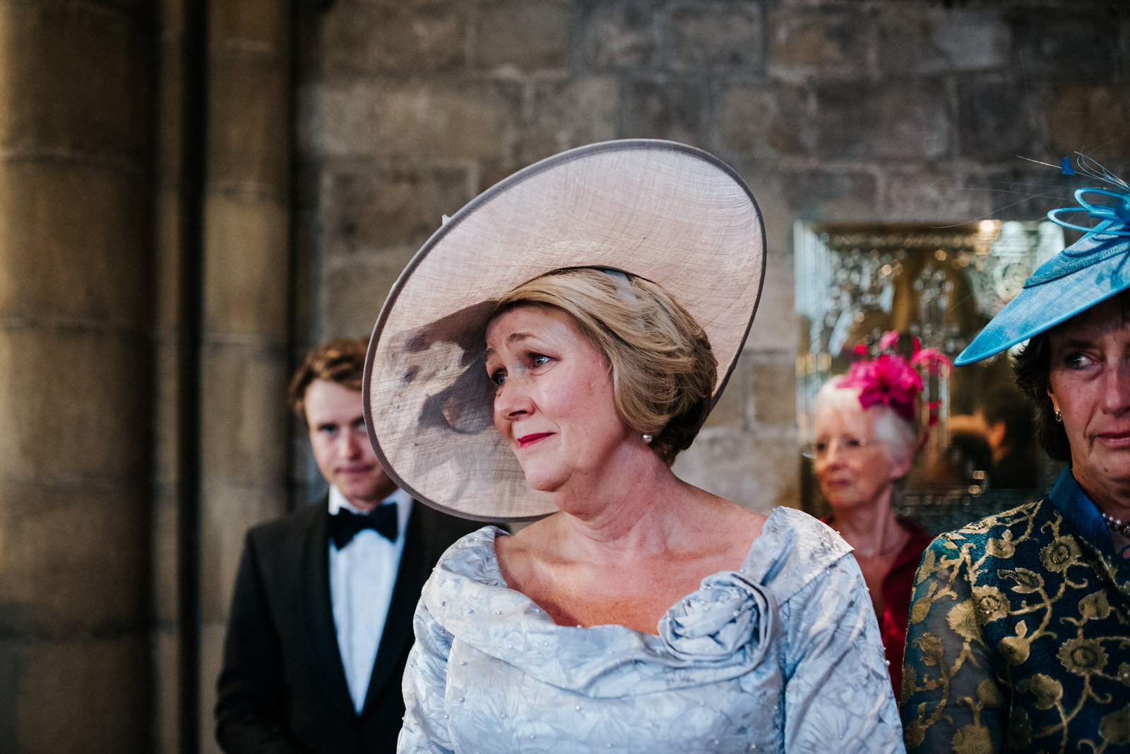 Mother of the bride tears up as she sees her daughter walk down