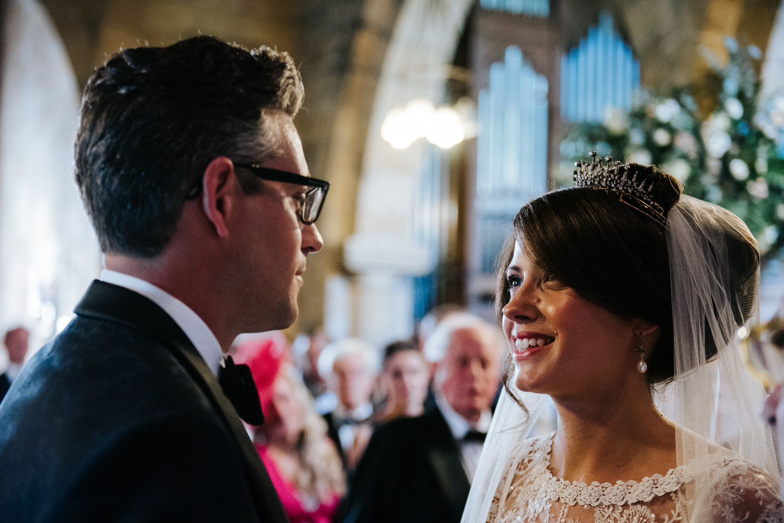 Bride looks into Grooms eyes and smiles cheek to cheek inside Ch