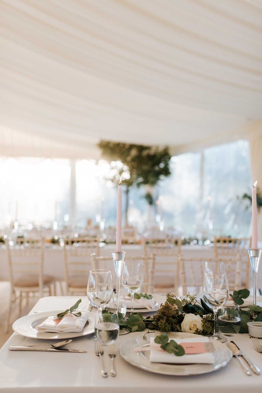 Close-up of flowers by Twinkling Twine on table setup inside stu