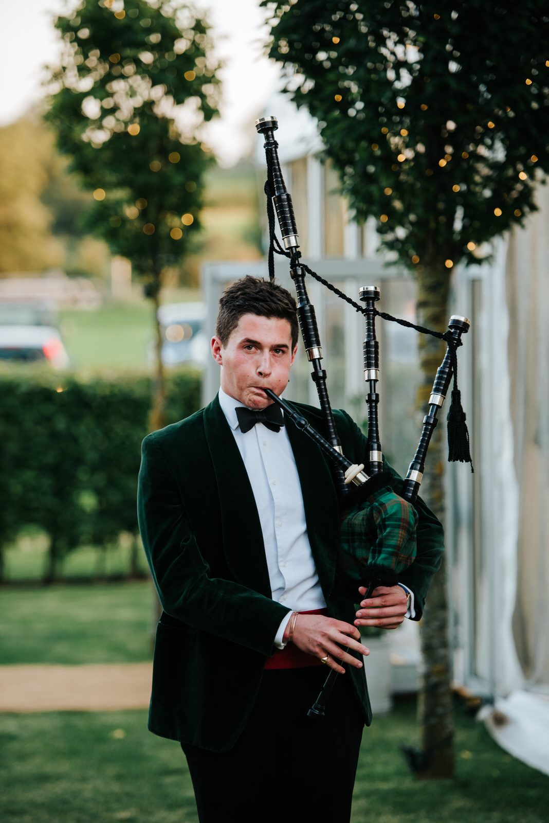 Bagpipe Player ushers guests into the Garden Marquee