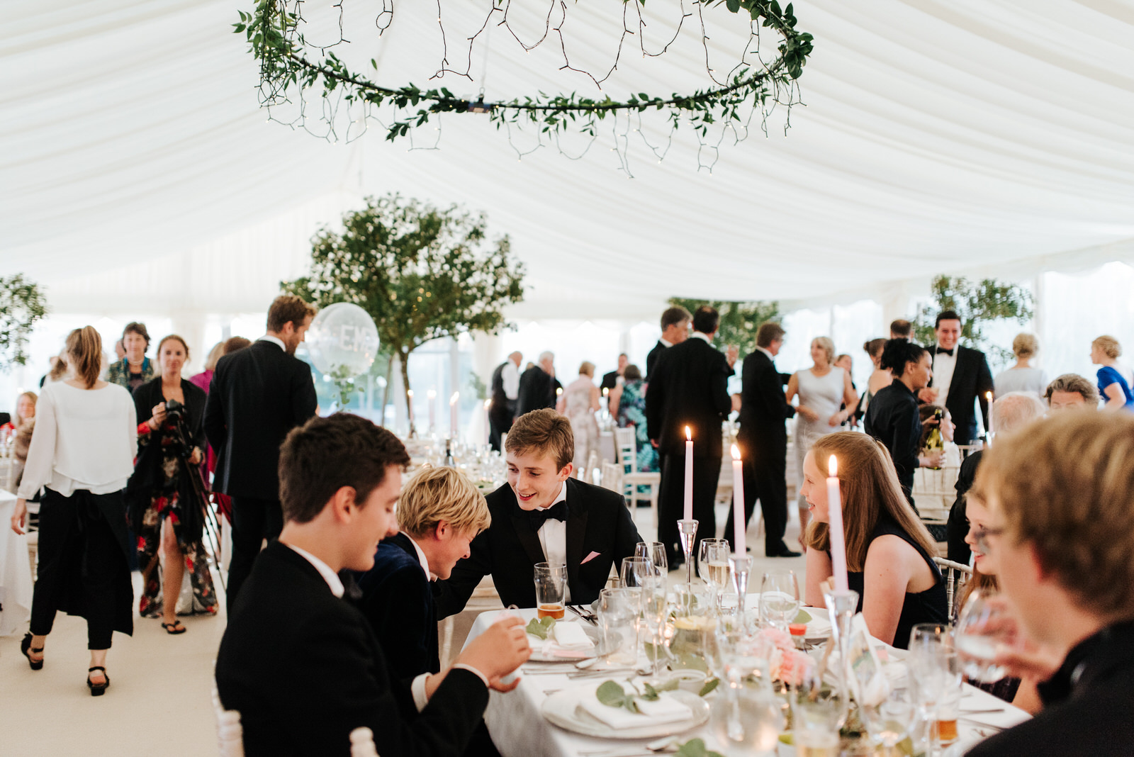 Guests make their way to their tables inside Garden Marquee