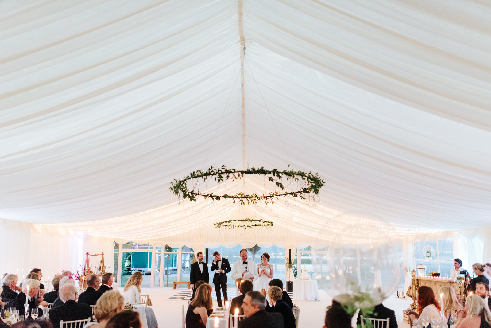 Wide shot of beautiful garden marquee in Yorkshire as speeches a