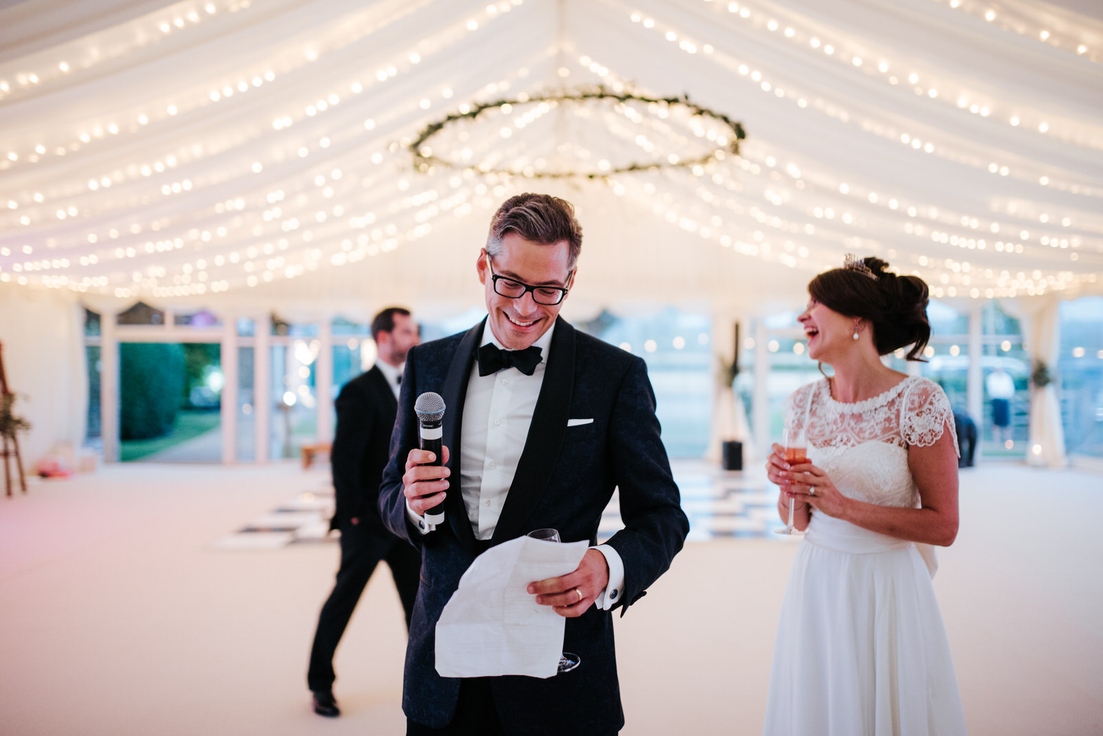 Groom smiles as he is about to begin his speech inside Marquee