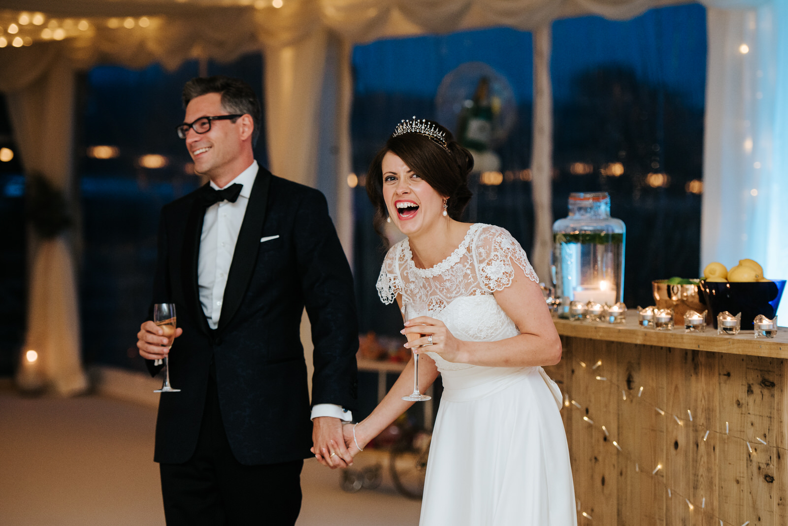 Bride laughs as other speeches are delivered