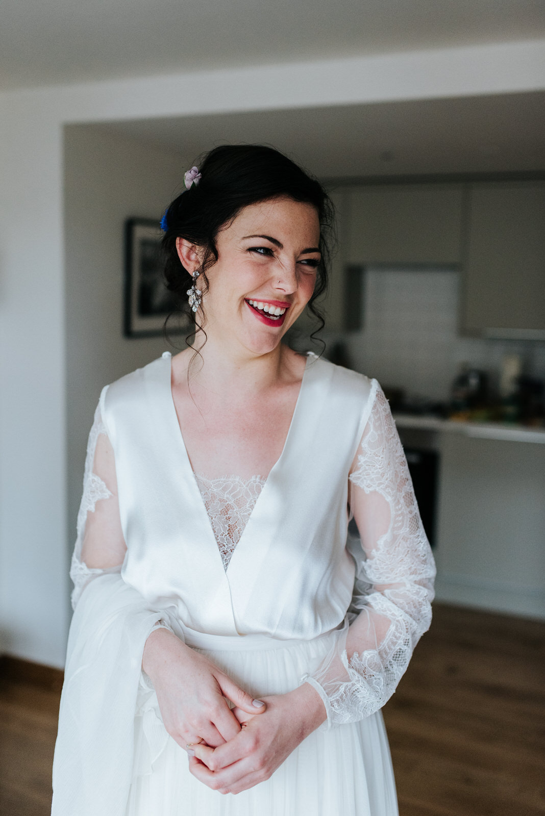 Portrait of bride smiling before she heads to the wedding ceremo