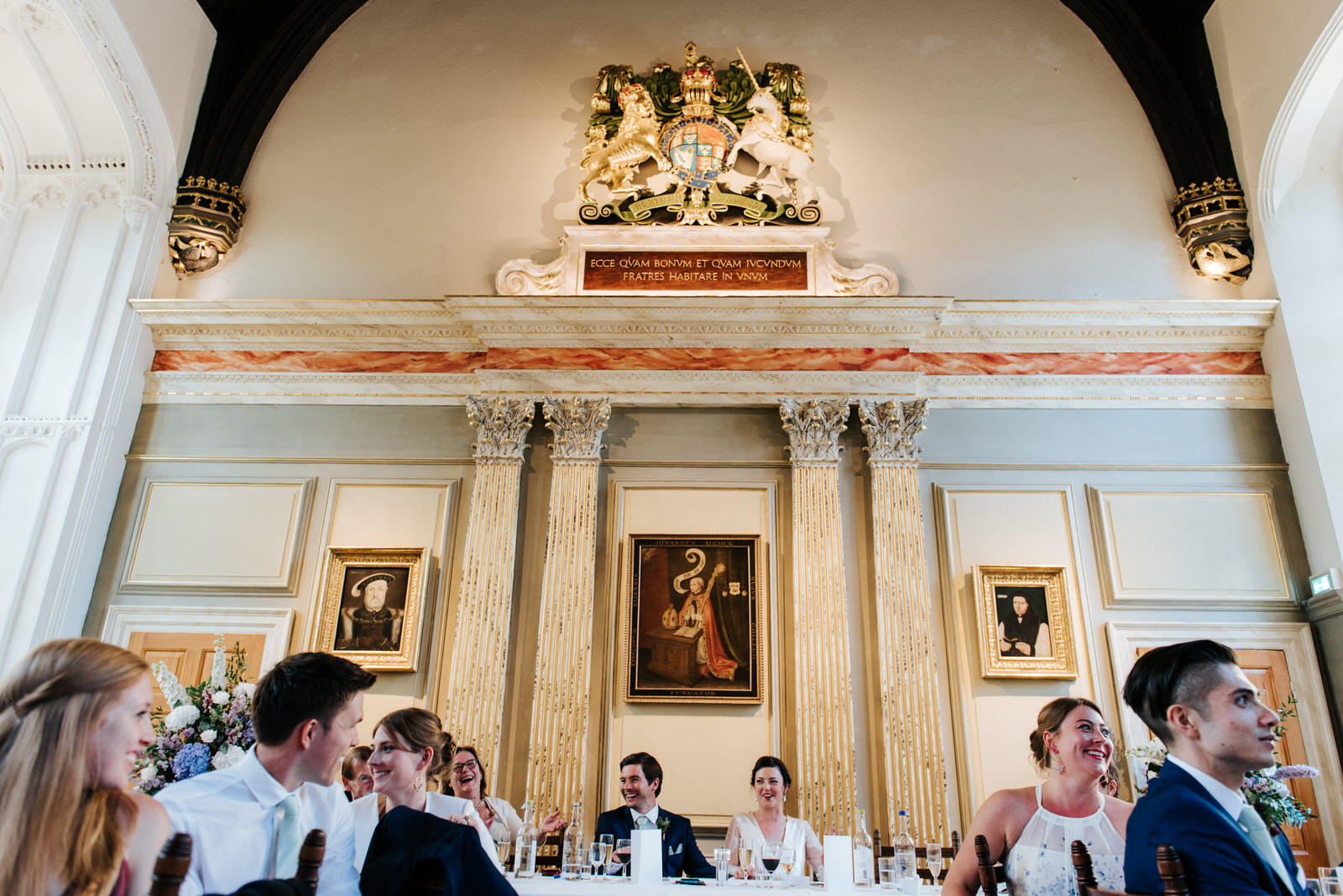 Wide photo of bride, groom and wedding party enjoying themselves