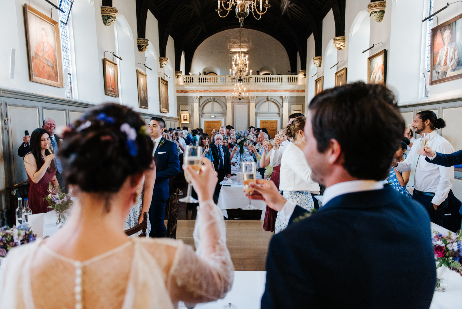 Guests raise a toast to the new bride and groom after father of 
