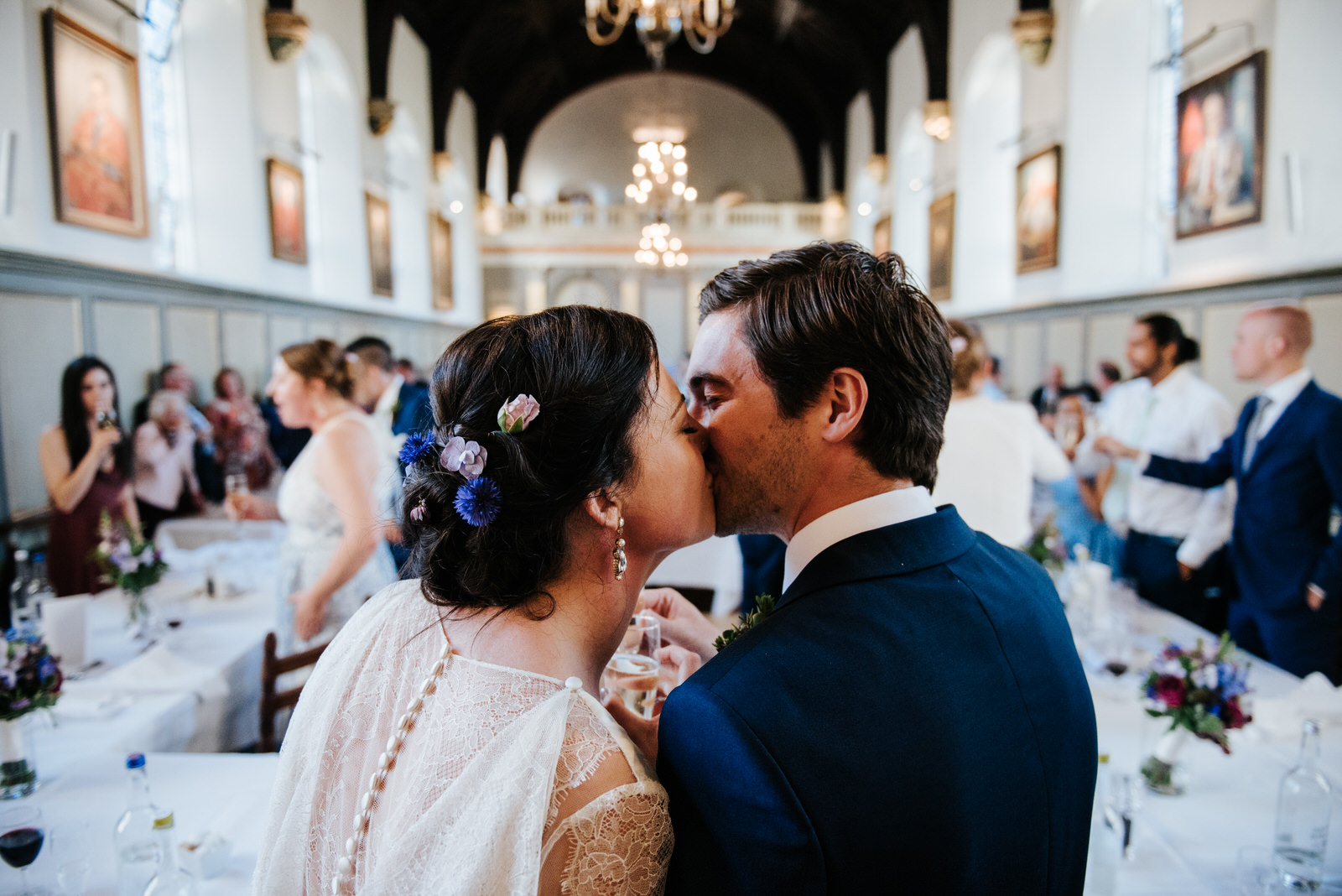 Bride and groom kiss after wedding speeches
