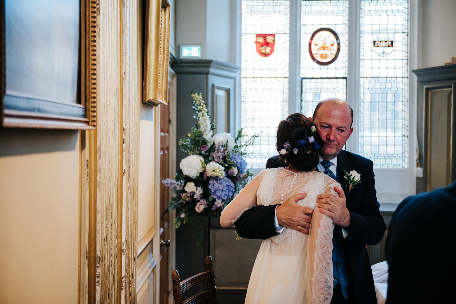 Bride hugs her father as she finishes her wedding speech