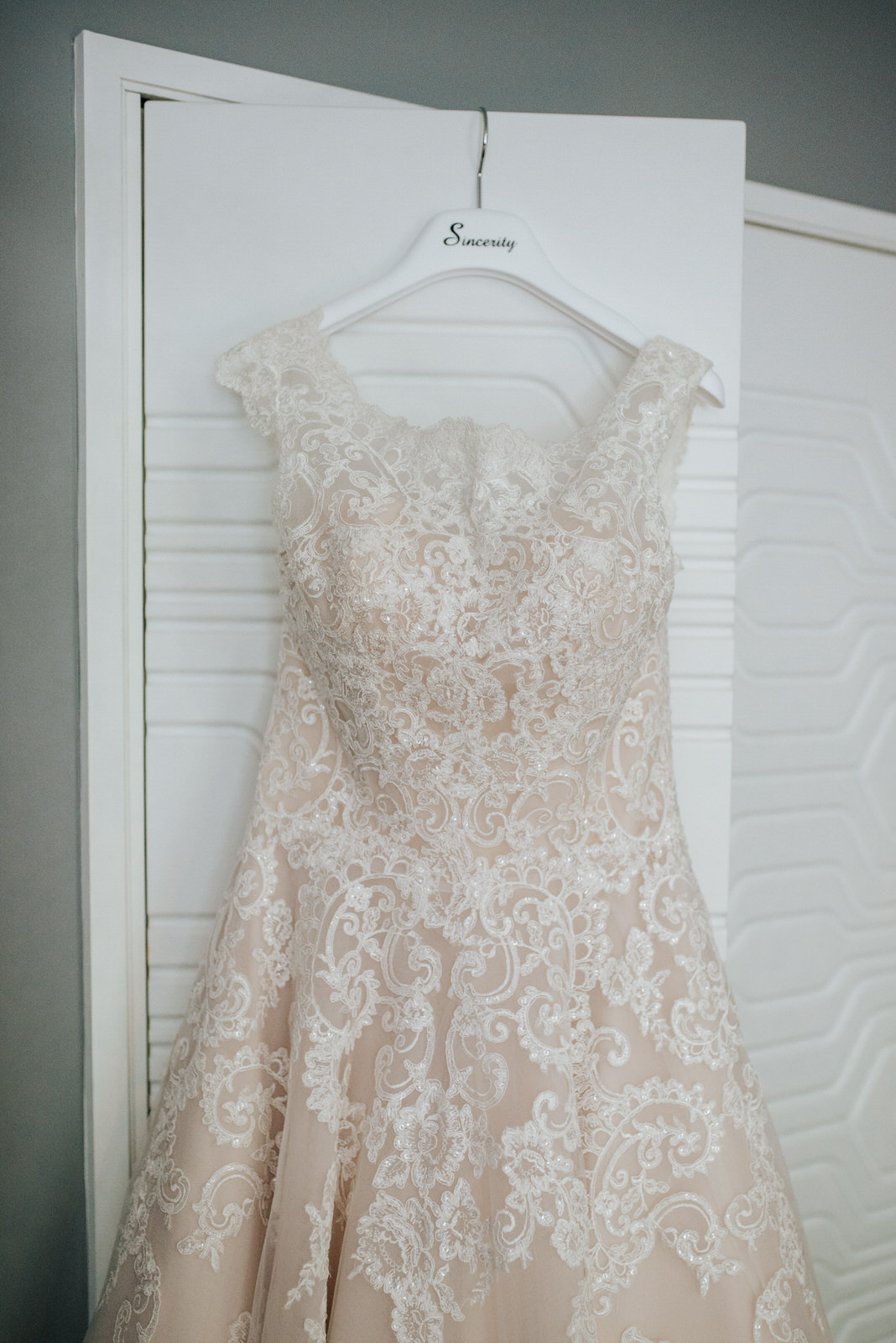 Beautiful white dressing hanging from the wall during prep