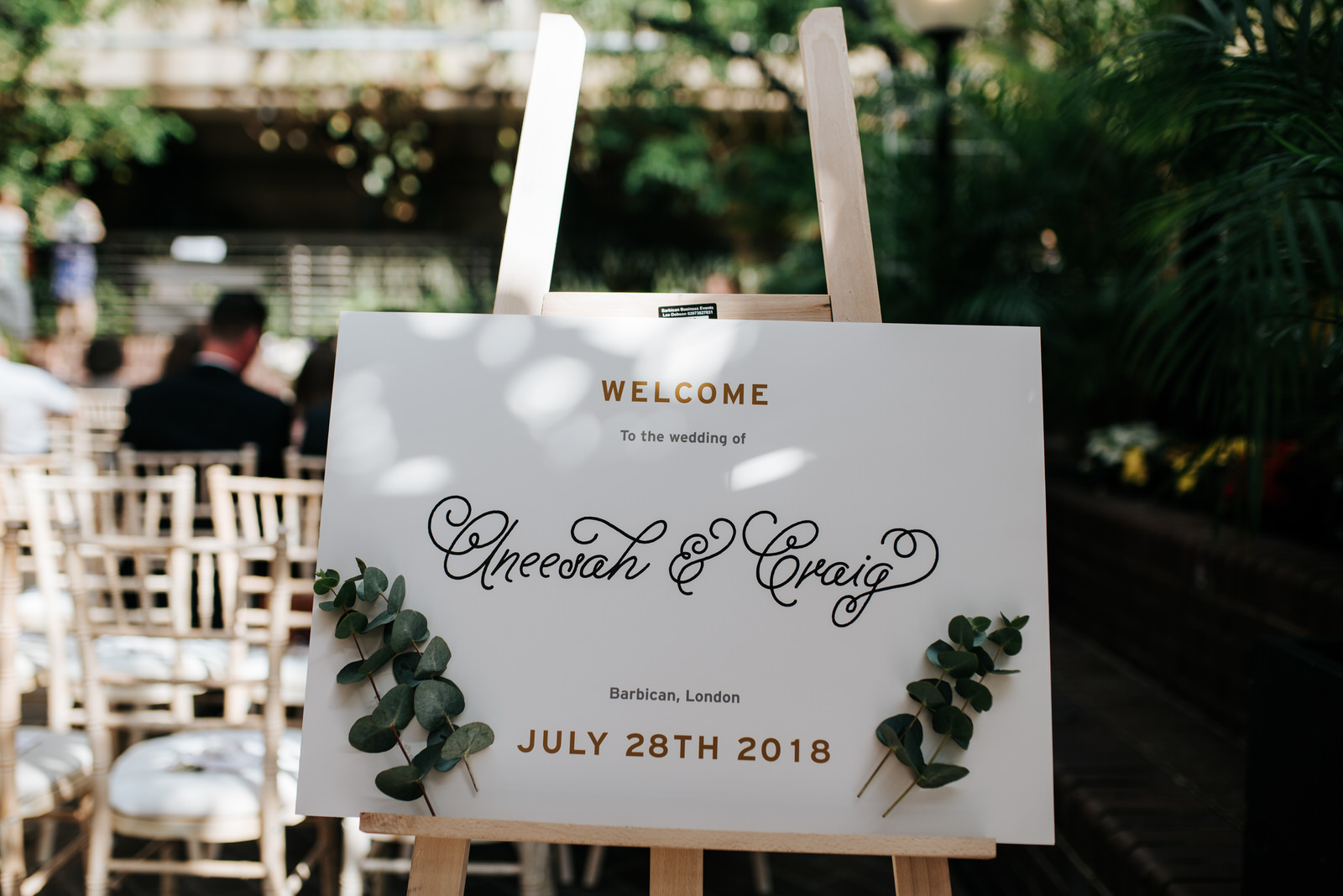 Sign that reads welcome to the wedding of aneesah & craig at bar