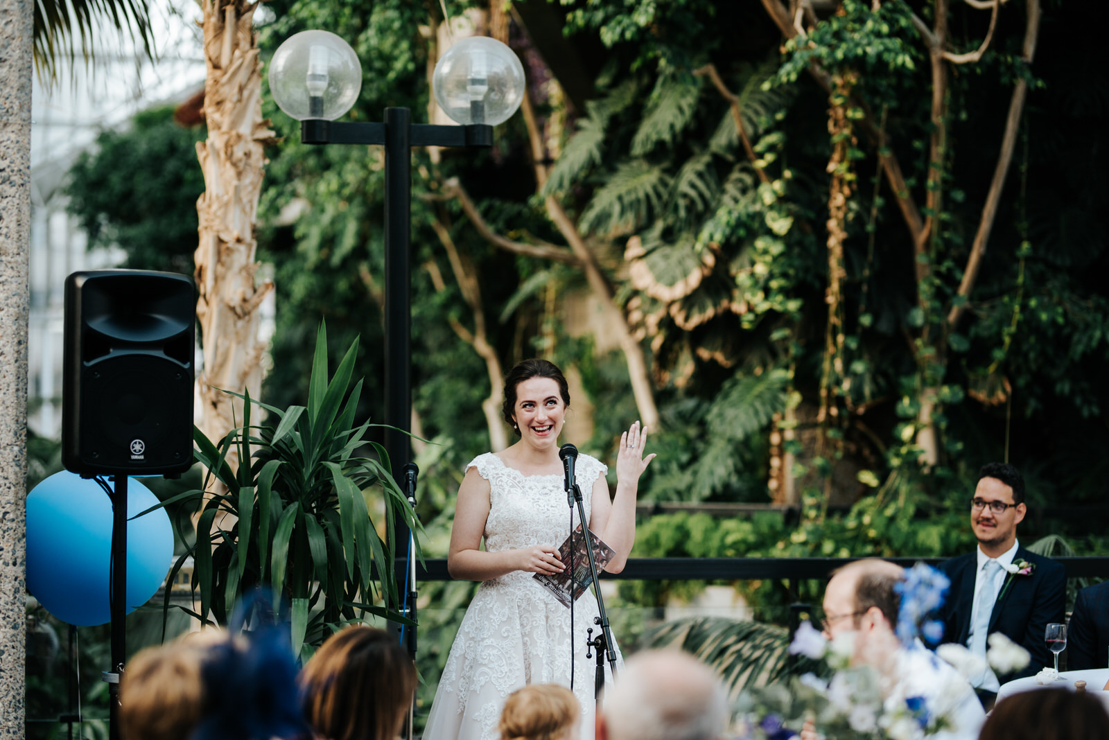 Bride looks happy and grateful as she is delivering her wedding