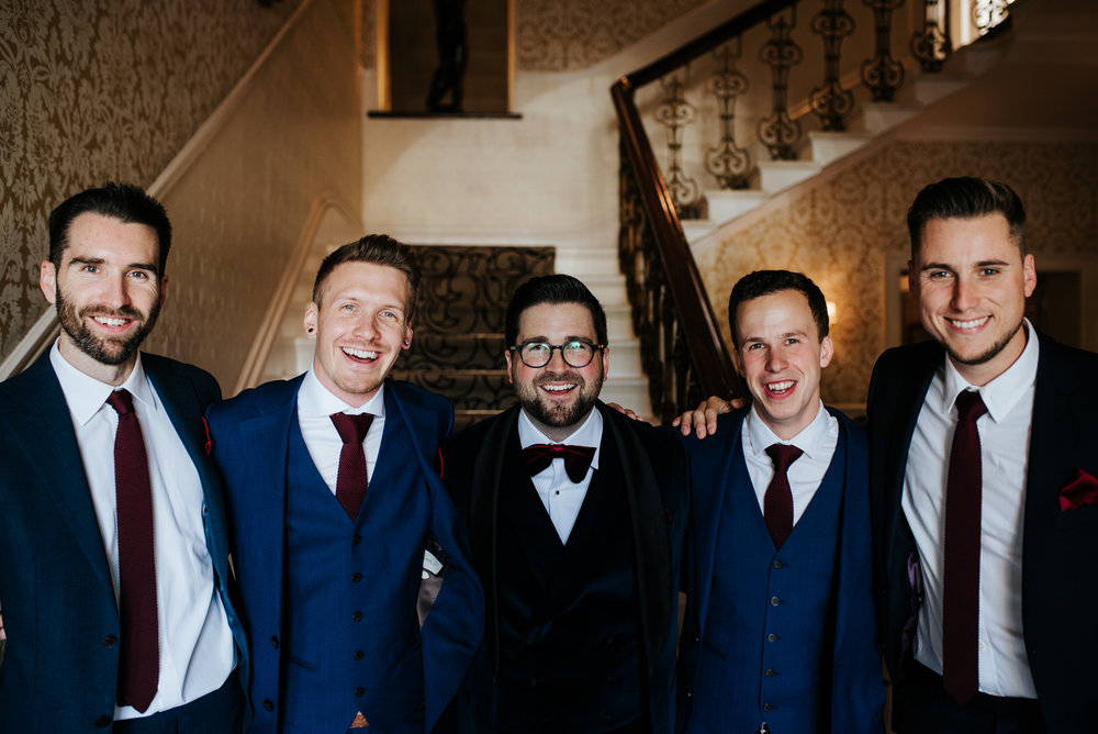 Group-shot of groom and groomsmen as they prepare to leave The Petersham hotel 