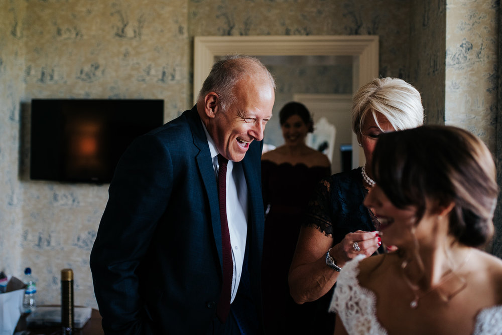 Bride's step-dad jokes around as he sees her in her dress