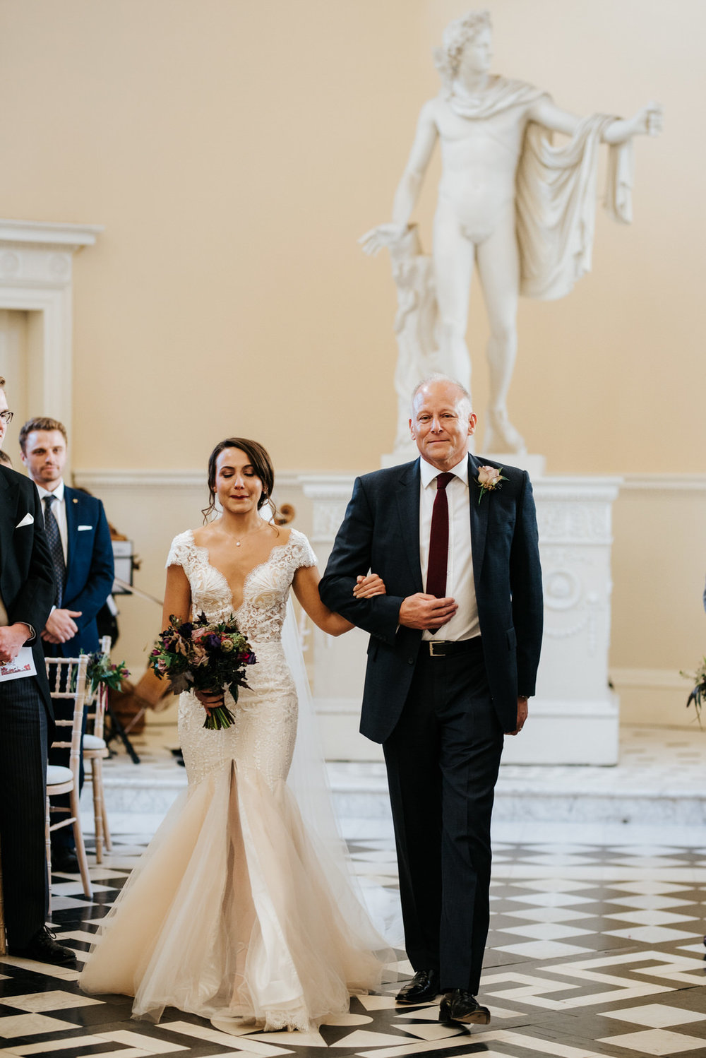 Bride about to start crying as she walks down aisle with step-dad