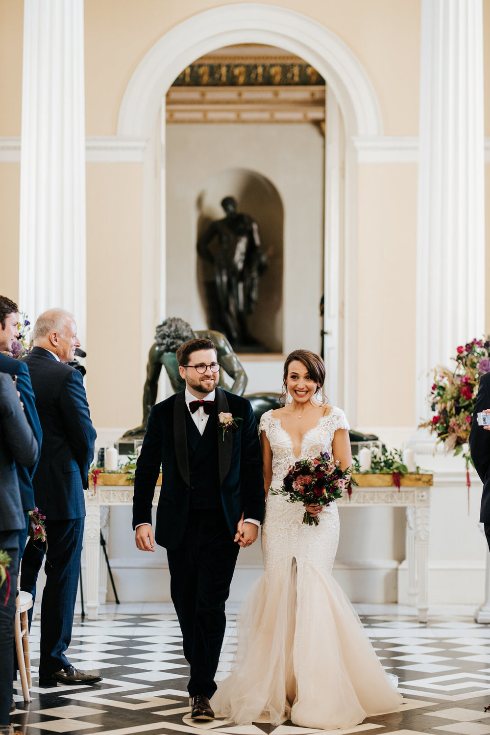Bride and groom exit down aisle as a married couple