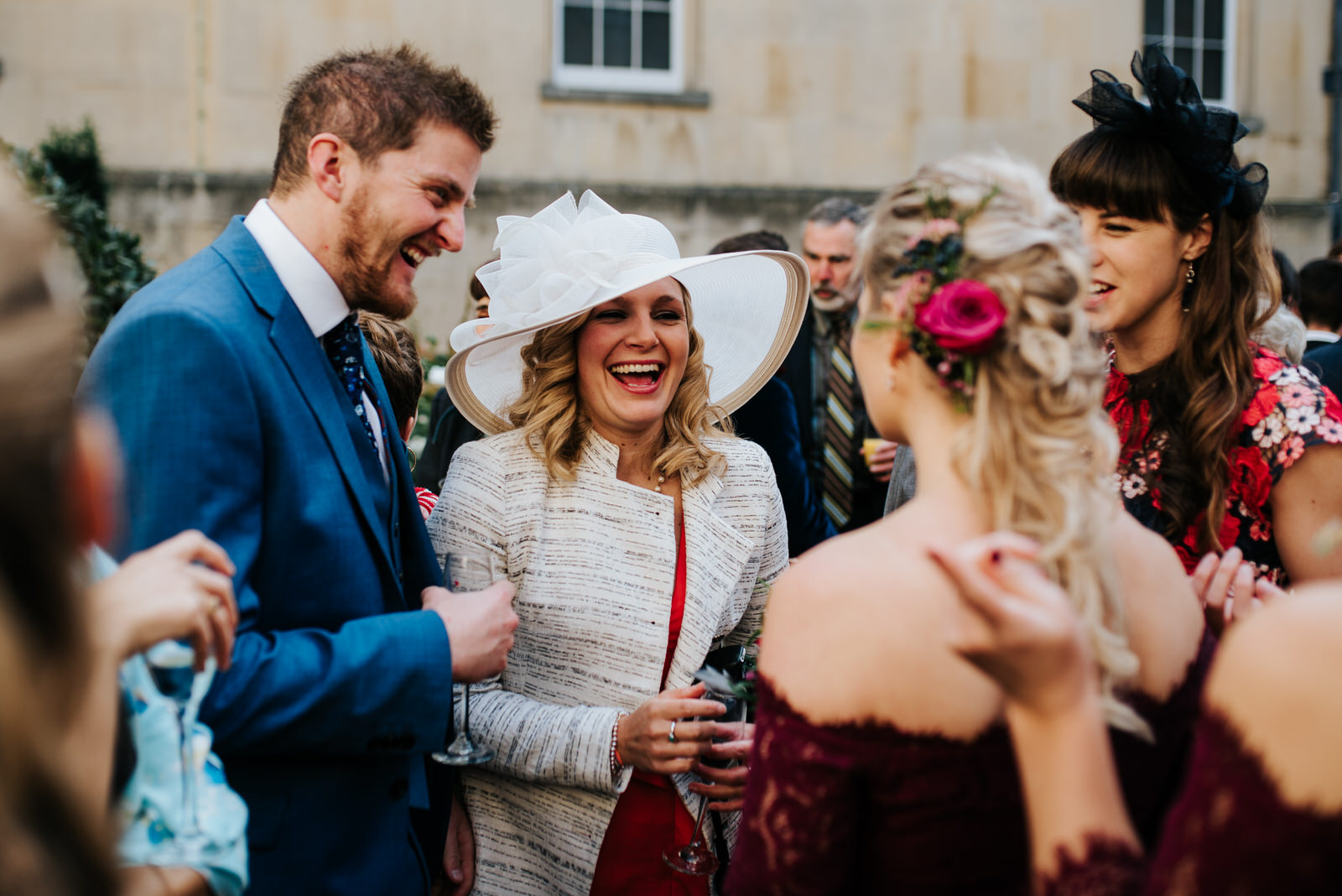 Candid moment of guests talking to each other after wedding ceremony