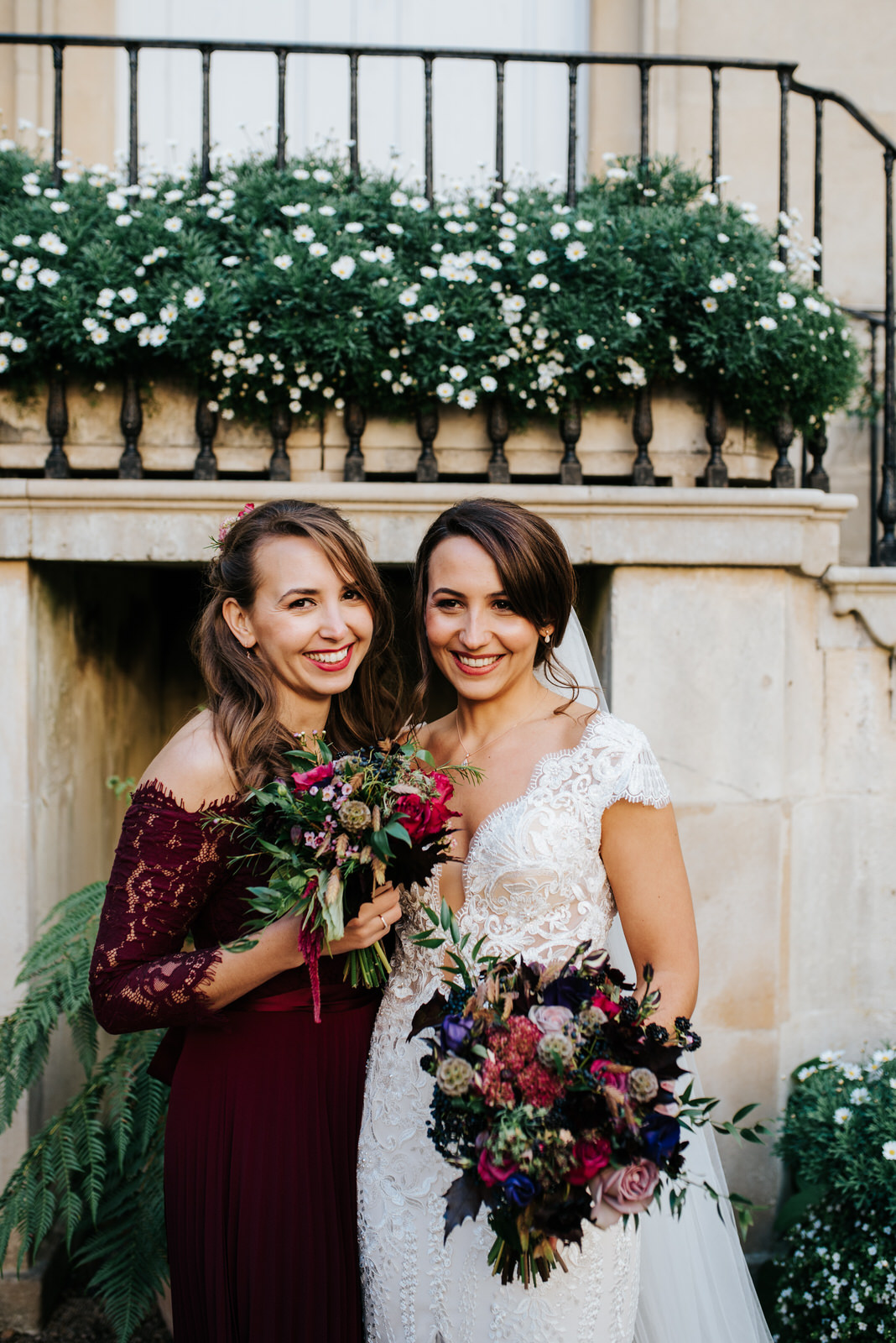 Posed photo of bride and her sister looking very natural