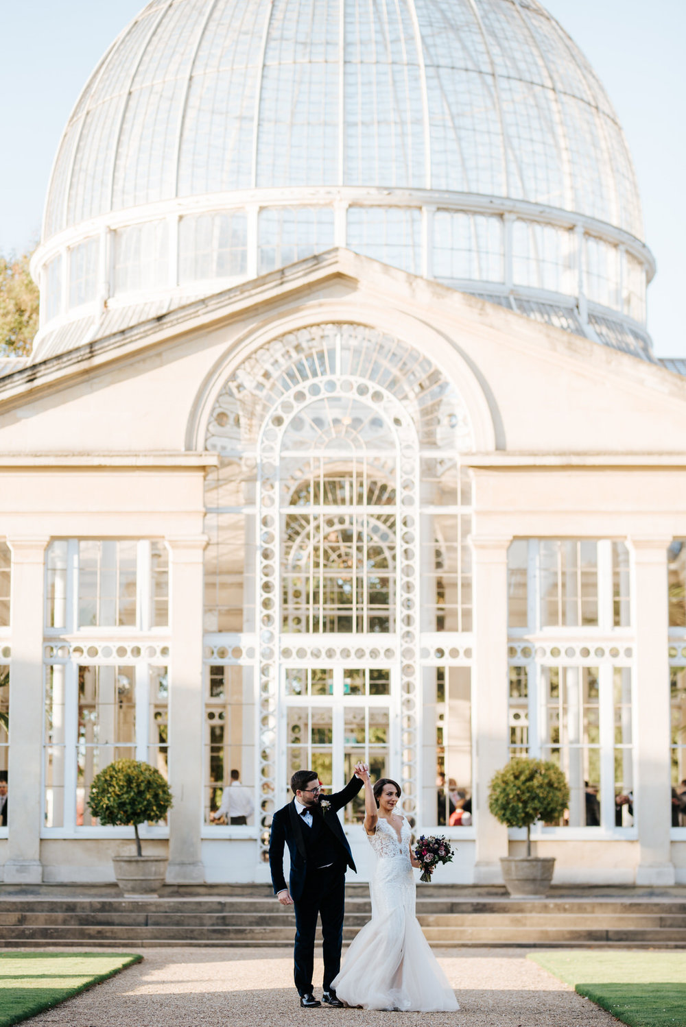 Bride and groom dance in front of Syon House's great conservatory building