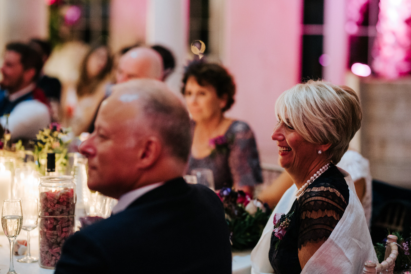 Bride's mum listen's to grooms speech and smiles