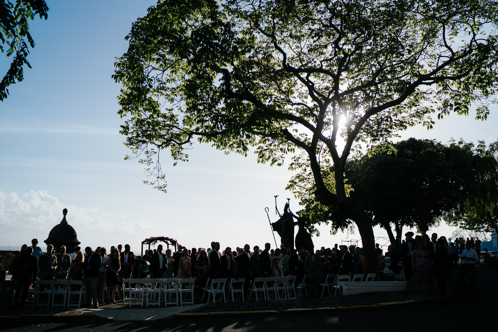 Silhouetter shot of all the guests waiting in the streets of Old San Juan Puerto Rico for the wedding to begin