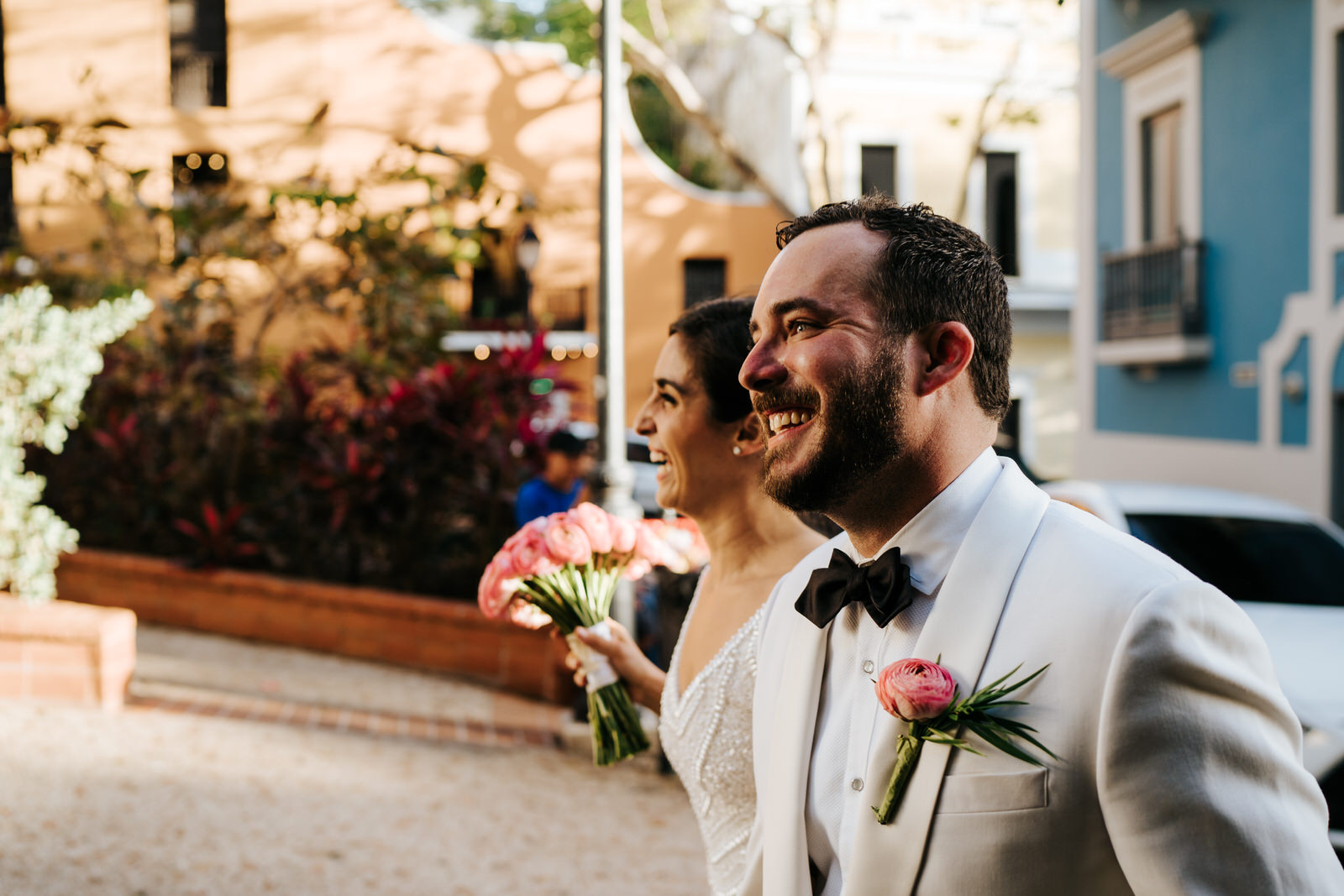 Bride and groom arrive at El Convento Hotel Wedding Venue and smile