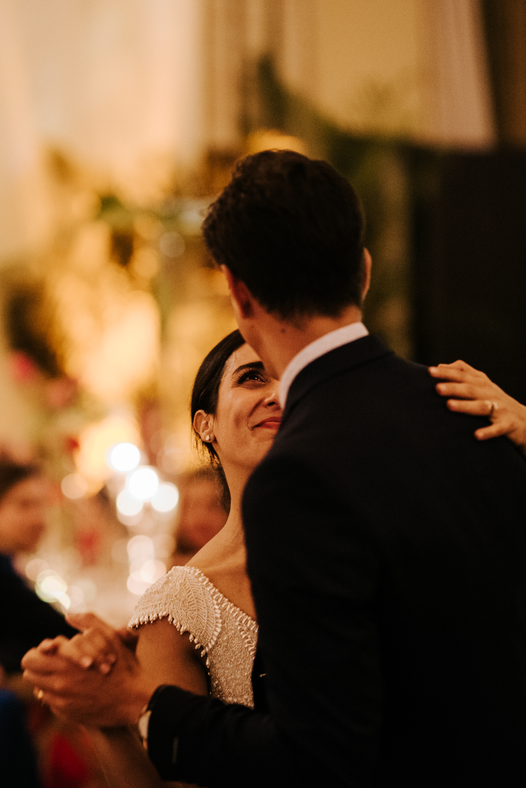Bride dances with family member as she looks at him very happily