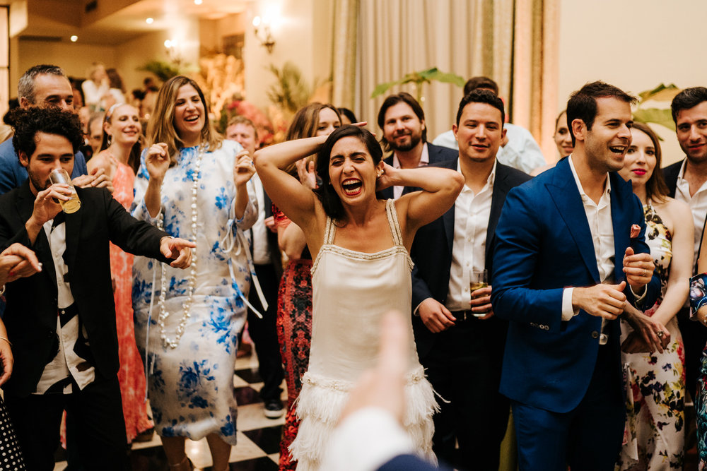  Bride is laughing in hysterics on the dancefloor 