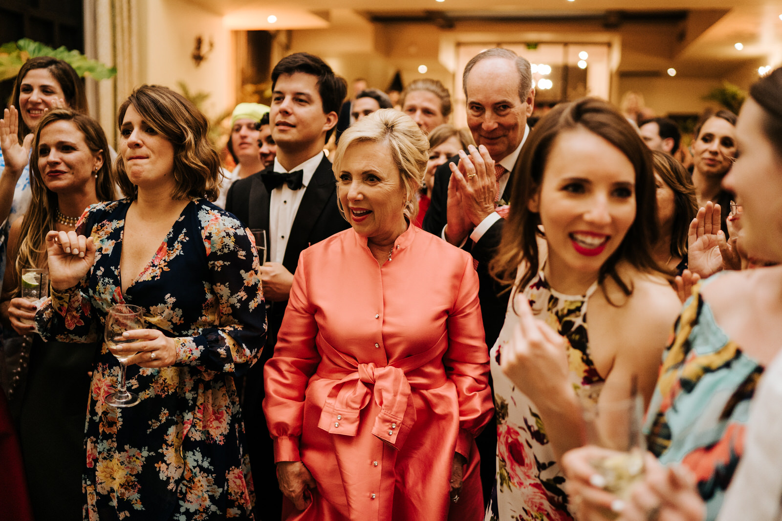 Groom's mother is happy and in shock as she looks at everyone dancing to the Puerto Rican pleneros
