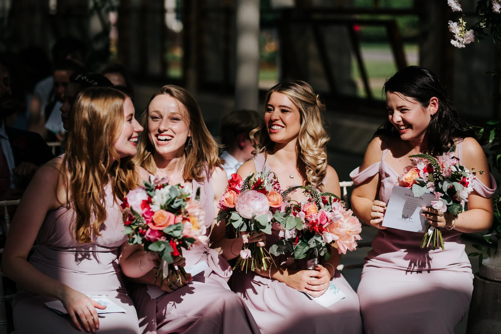 Bridesmaids cannot contain their excitement after bride and grooms first kiss at nash conservatory wedding in Kew Gardens