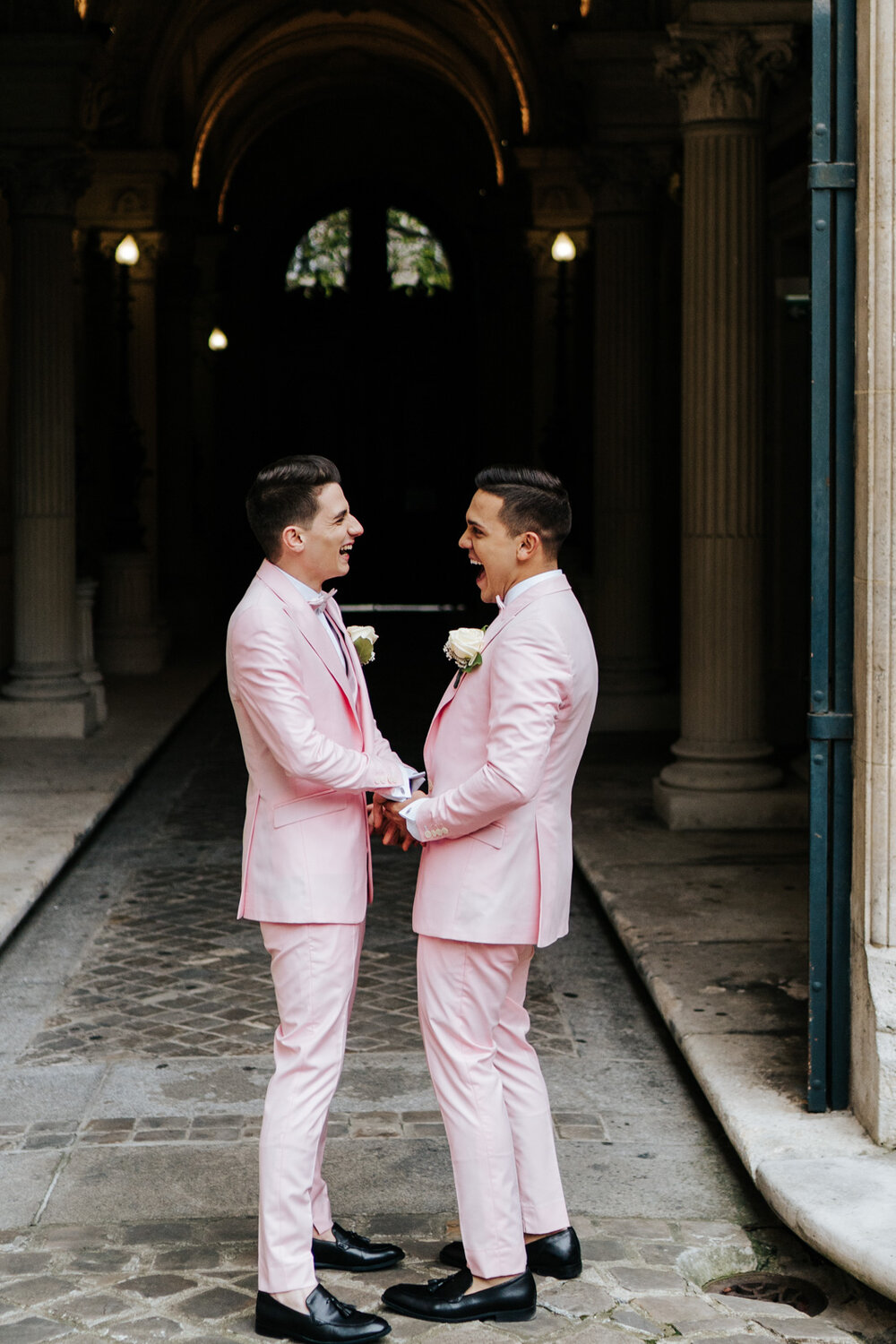  Two grooms in millenial pink tuxedos do first look at Paris wedding ceremony 