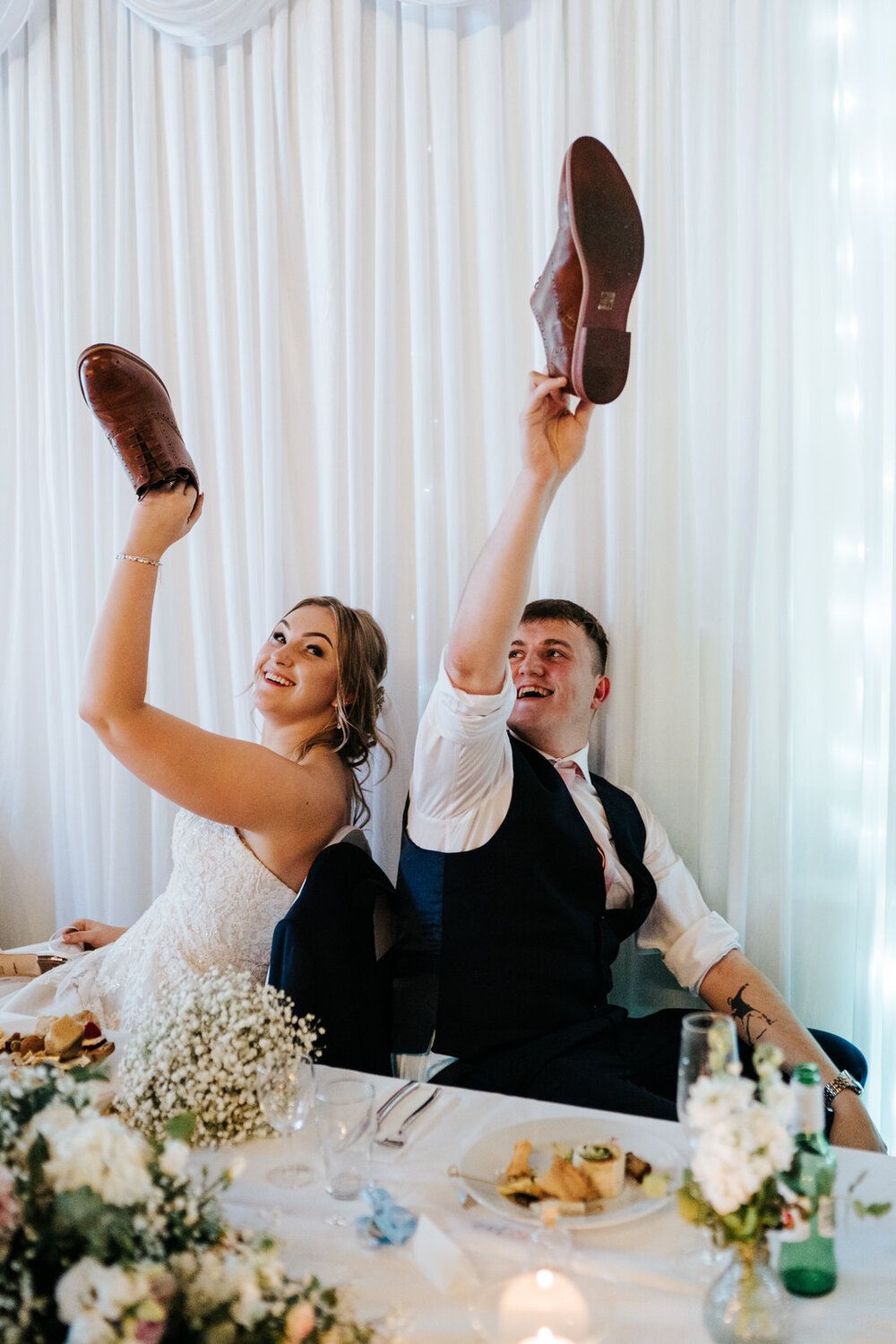 Bride and groom play an entertaining game during their wedding reception