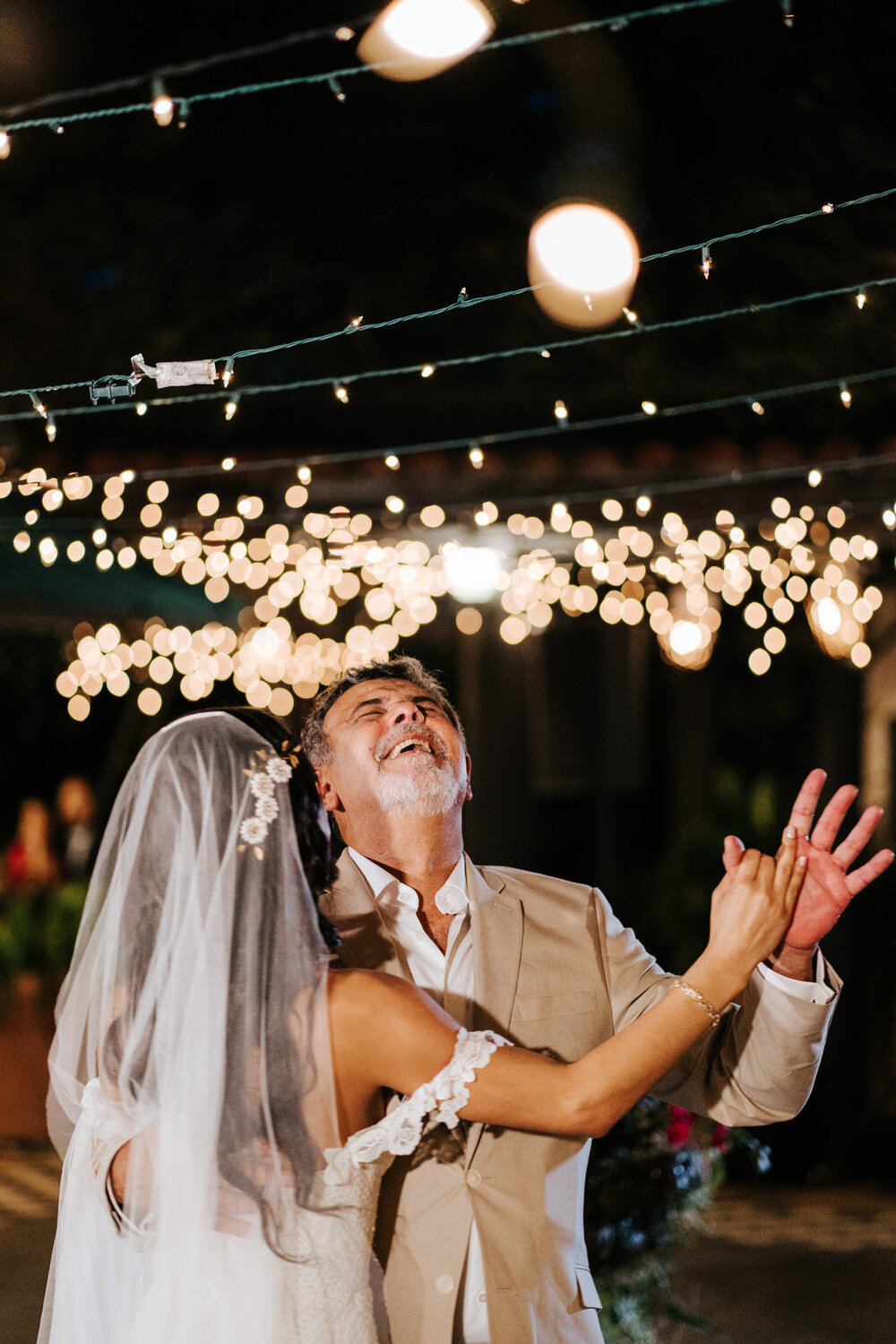 Father of the bride cannot contain his excitement during first dance at Puerto Rican wedding