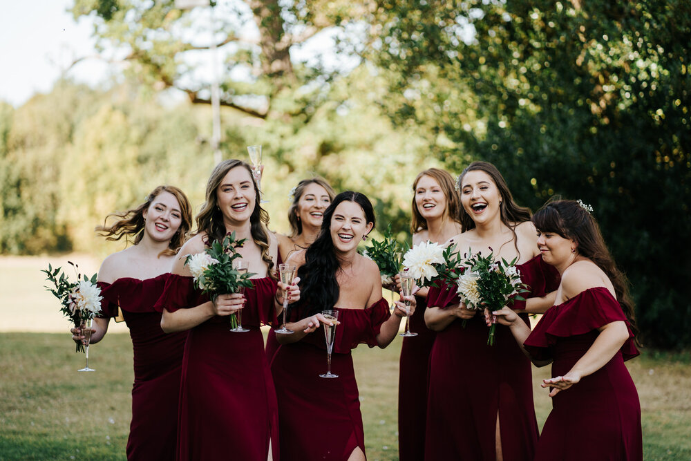 Bridesmaids have a good time during drinks reception