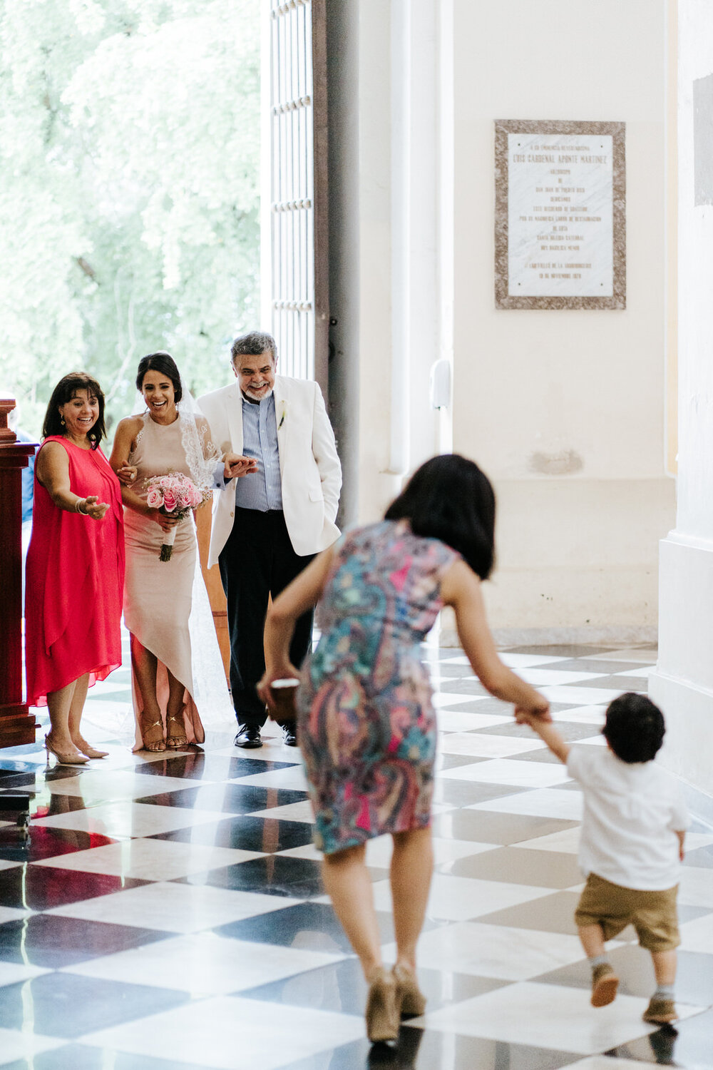 Bride's nephew rushes towards bride minutes before church ceremony in Puerto Rico