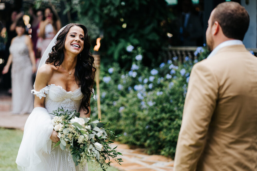 Bride is just as joyful as groom as she looks at him with a very (Copy)