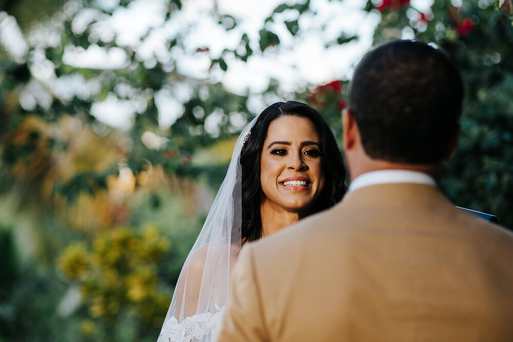 Bride smiles and looks at groom, who is front of frame and out o (Copy)