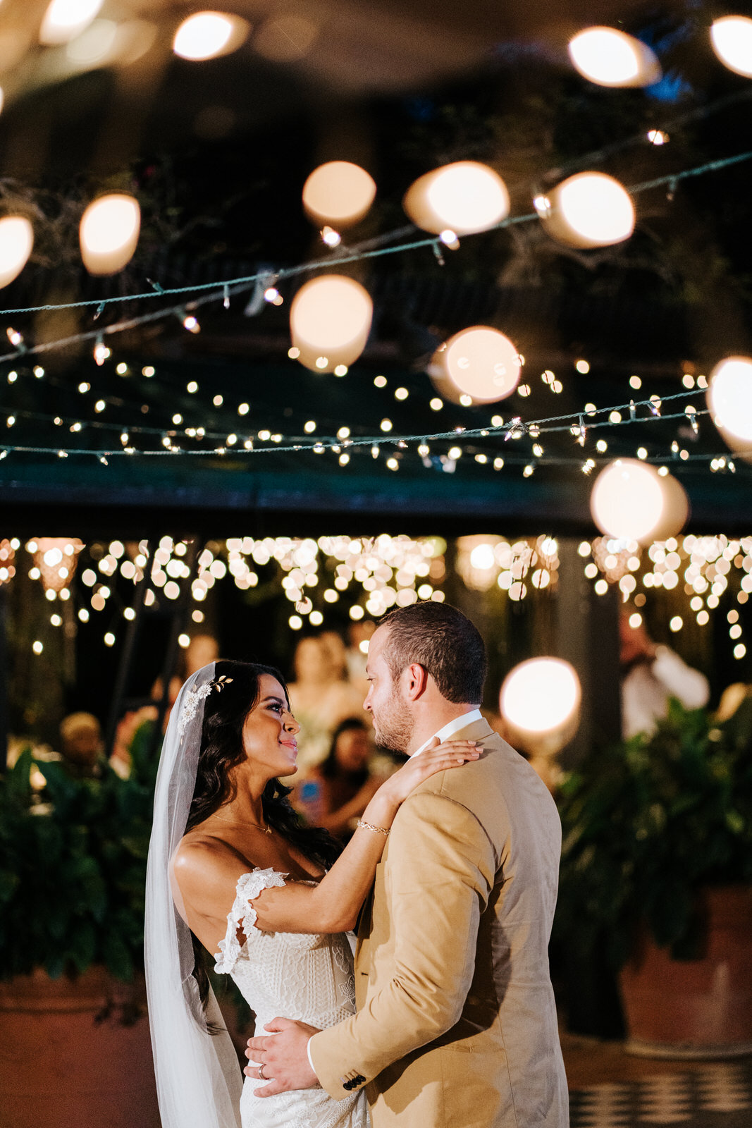 Bride and groom look each other in the eyes and perform their fi (Copy)