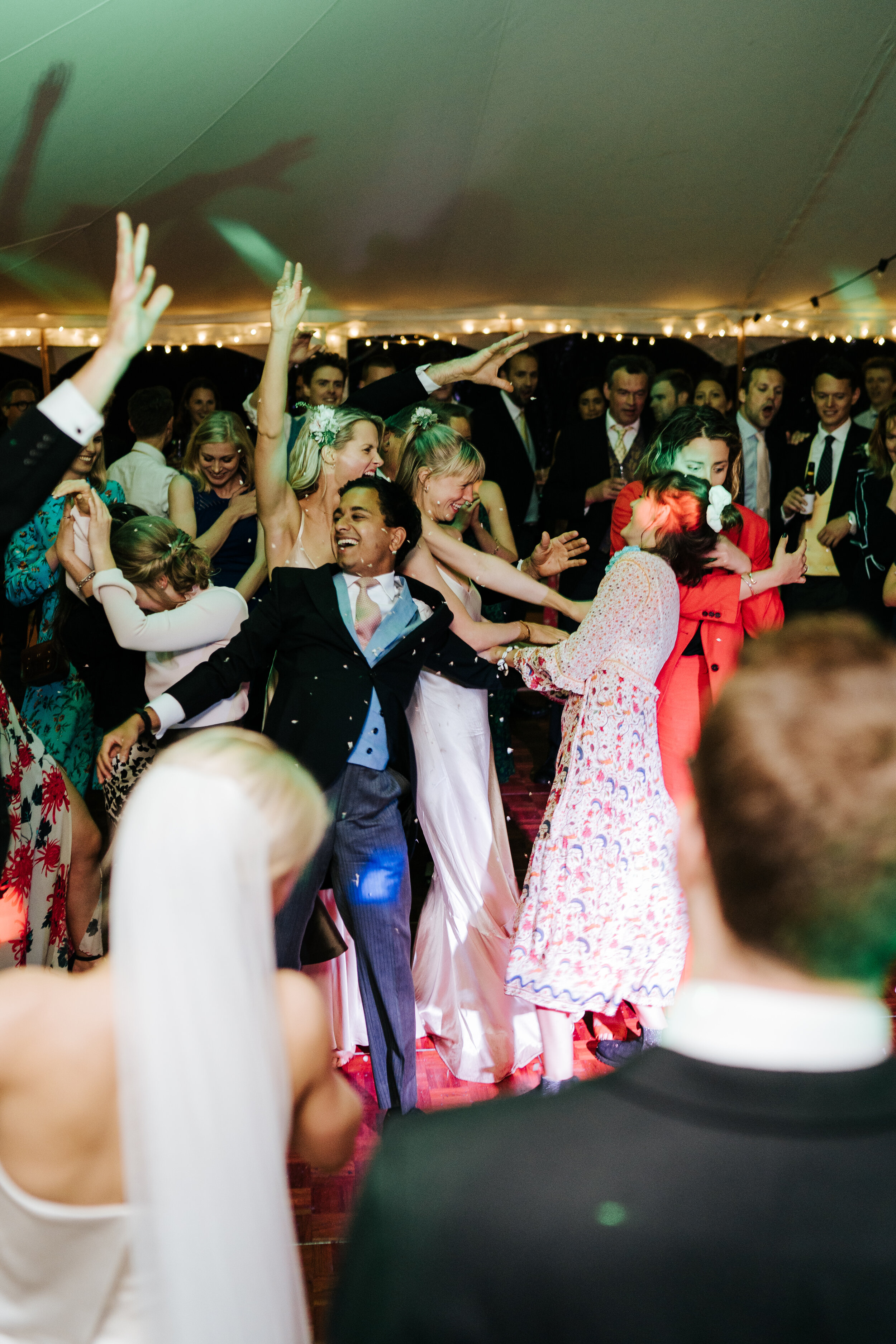 Chaos on the dancefloor as a lot of guests try to catch the bouquet at once